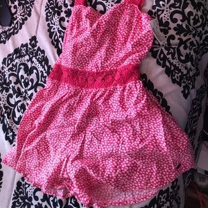 Pink, open back Romper.